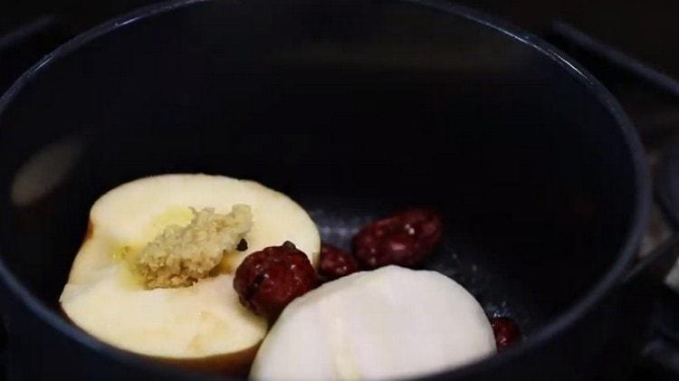 Add grated ginger, garlic and dates grated on a fine grater.