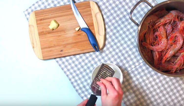 Grate ginger root, garlic.