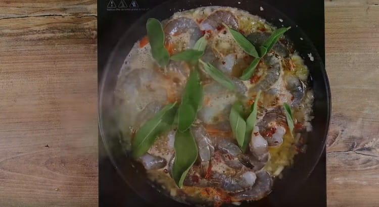 Add sage or oregano and simmer the shrimp for 15 minutes.