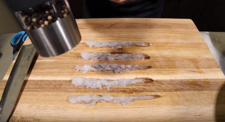 Salt and pepper shrimp to taste.