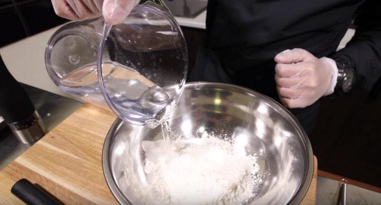Add water to the flour.