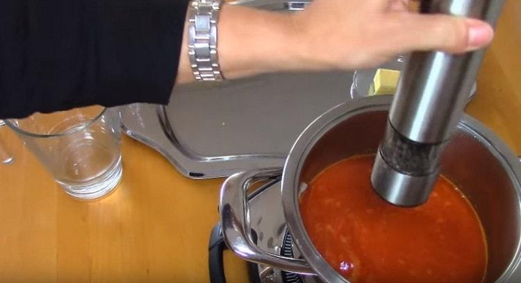 Salt and pepper the soup.