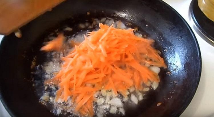 Add carrots to the onion.