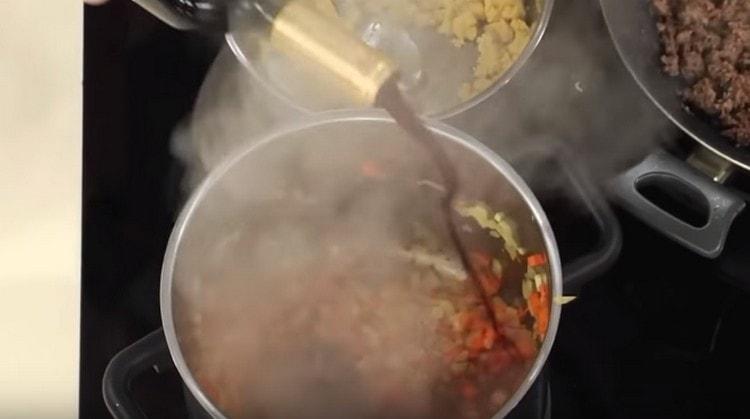 Add red wine to the vegetables.