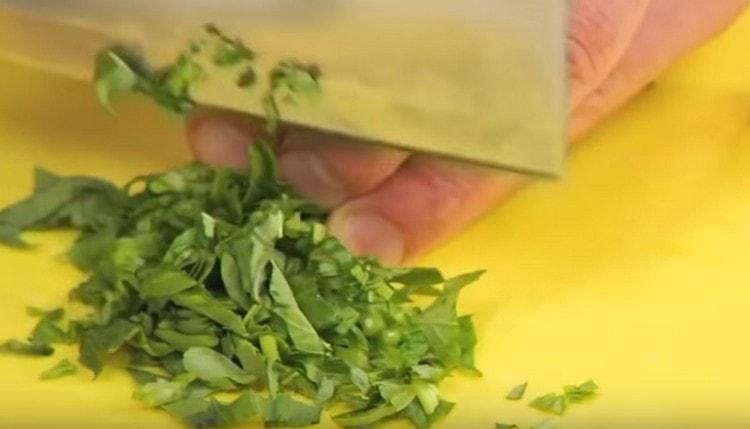 Grind fresh basil and add to the bolognese sauce.