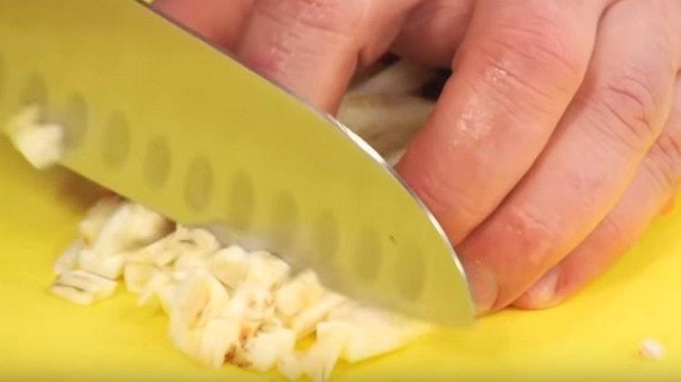 Finely chop celery.