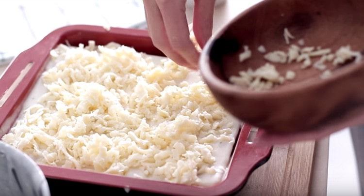 Sprinkle a grated mozzarella dish.