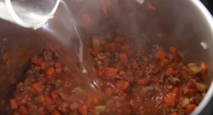 Add tomato paste and water.