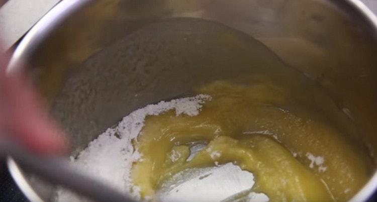 Add flour to the oil and mix.