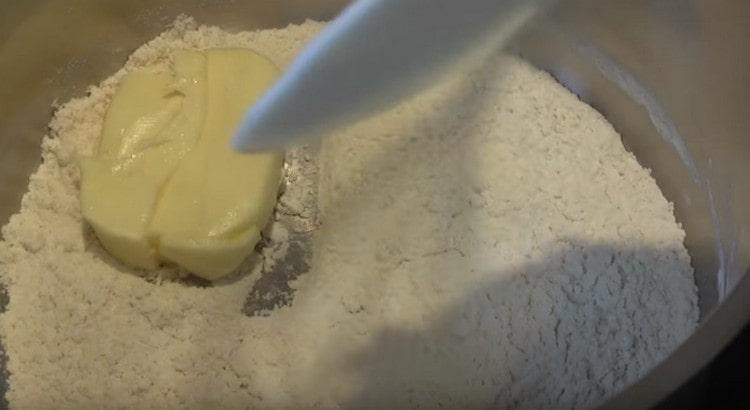 Add butter to flour, mix.