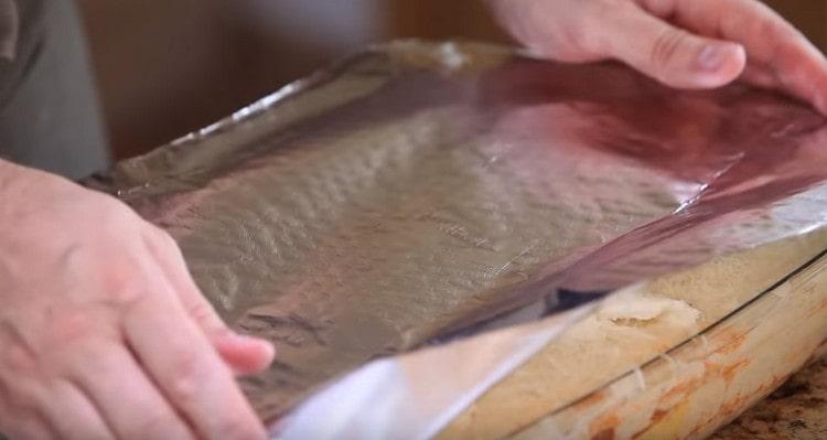 Cover the form with foil and put in the oven.