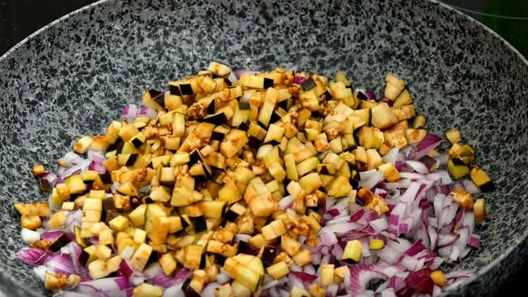 Next, fry the eggplant with onions.