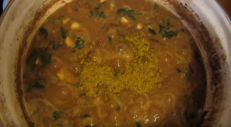 Add garlic and herbs to the dish.