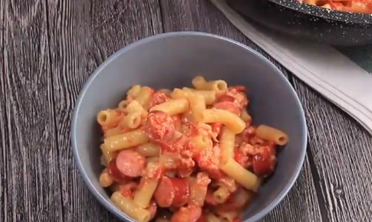 This interesting recipe will help you cook delicious pasta with sausages.