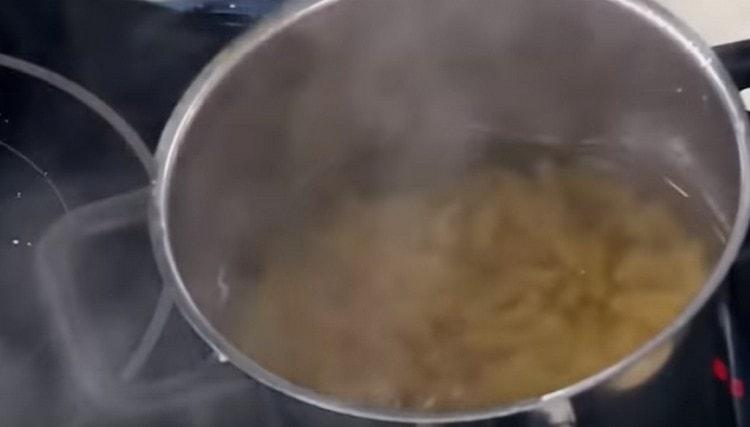 Pour pasta into boiling water.