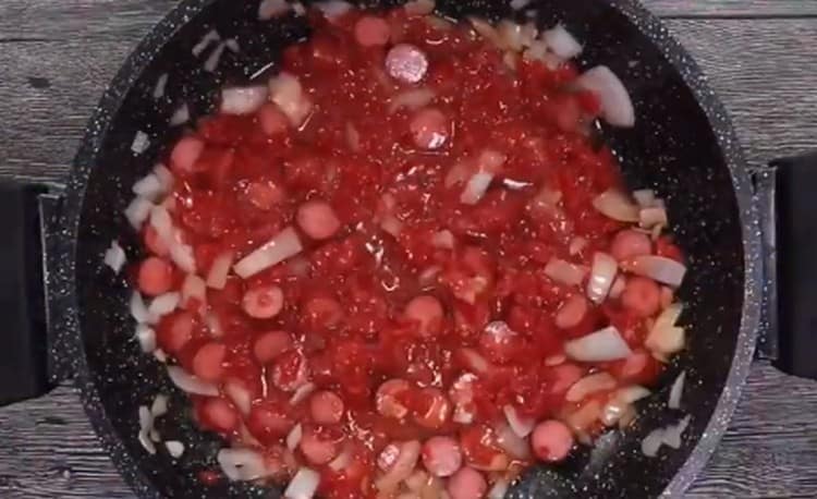 Add the tomato puree.