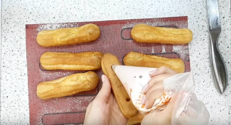 Fill eclairs with raspberry cream.