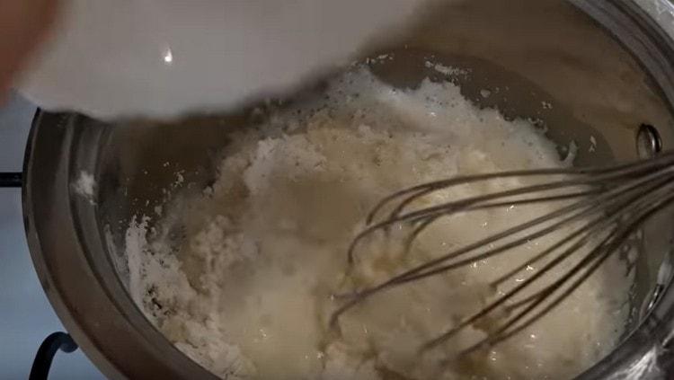 Pour flour into the boiling liquid.