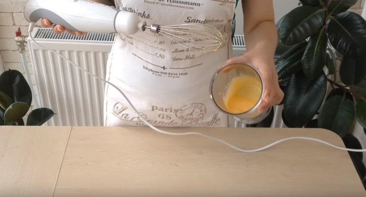 Separately, beat two egg yolks.