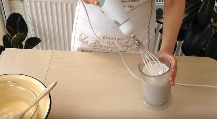 Separately, until fluffy, whip the cream.