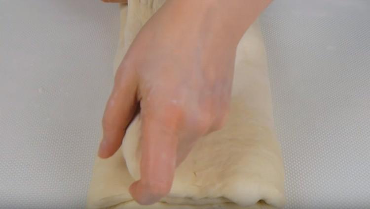 Stretch the dough again and fold it.