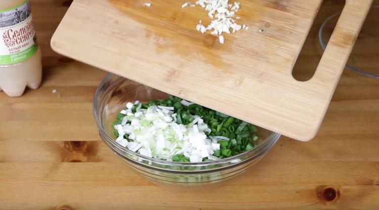 Add chopped garlic to the herbs.