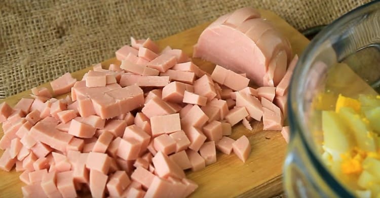 Dice boiled sausage.