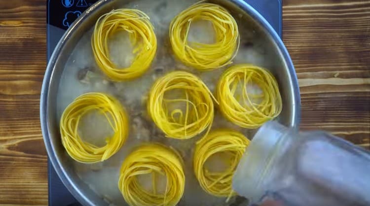 Add hot water and cover the pan with a lid.