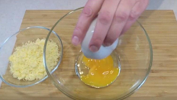 Pour the egg and two more yolks into the bowl.