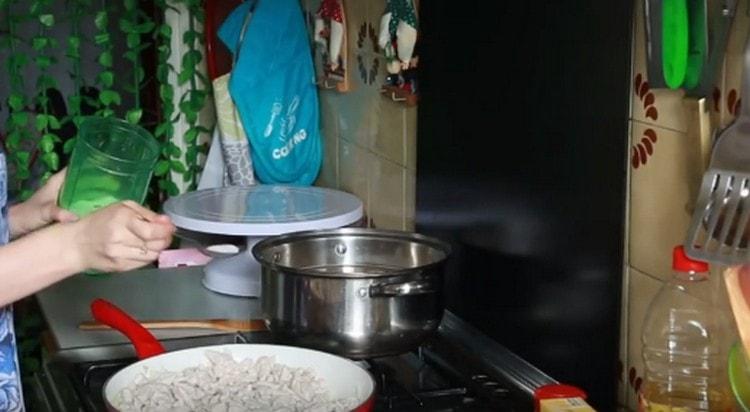 Add the onions to the pan, salt the dish.