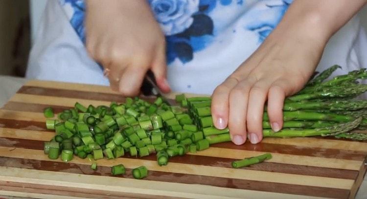 Chop asparagus.