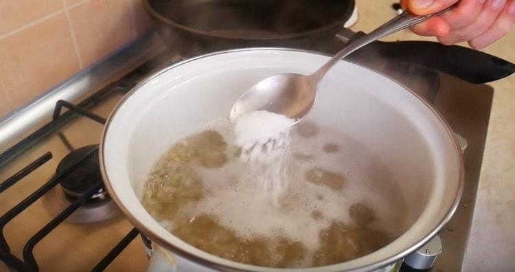 Add salt to boiling barley.