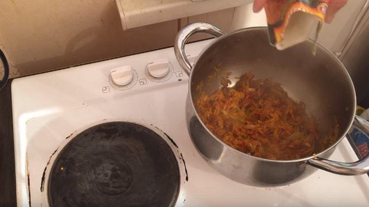 Add spices to the vegetables.