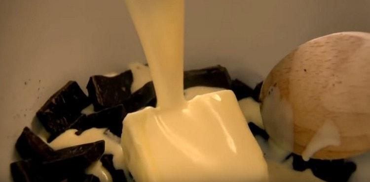 Add butter to the chocolate and fill it all with hot cream.