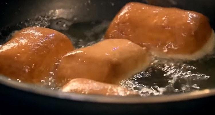 Fry donuts in boiling vegetable oil.