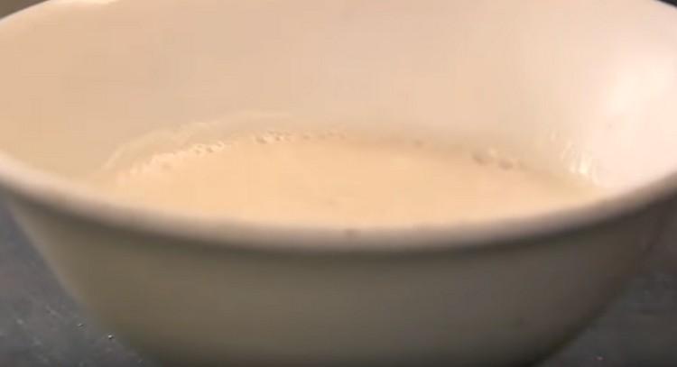 Leave the mixture of yeast and milk for a while.