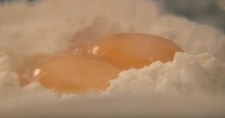Add salt and two yolks to the flour.