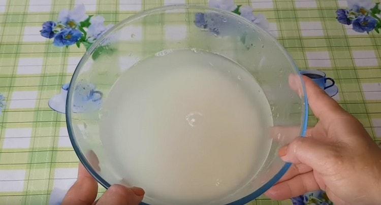 Pour boiling water over the rice.