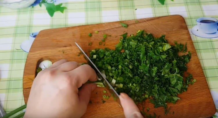 Grind garlic and herbs.