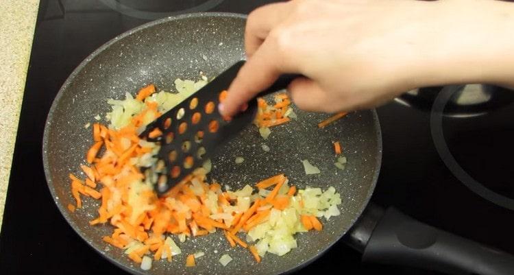 Add carrots to the onion.