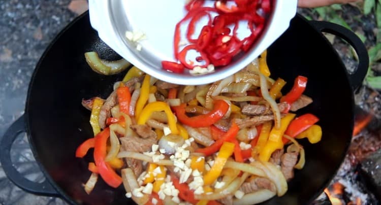 Now add hot pepper and garlic.