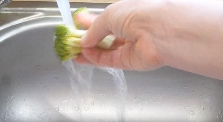 Each piece is then washed again under running water.