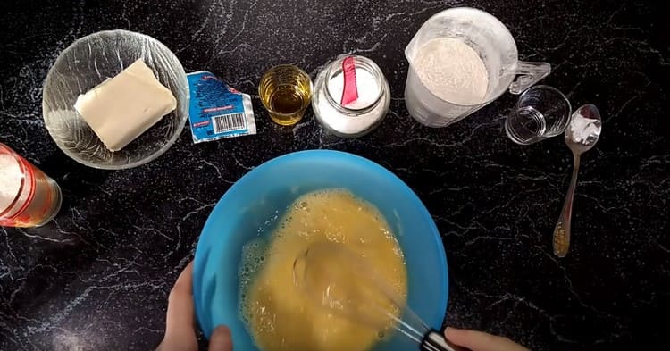 Beat eggs with a whisk.