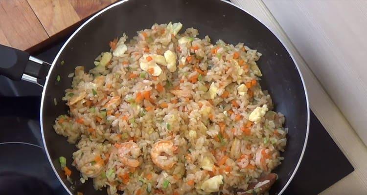 Stir, and rice with shrimp and vegetables is ready to serve.