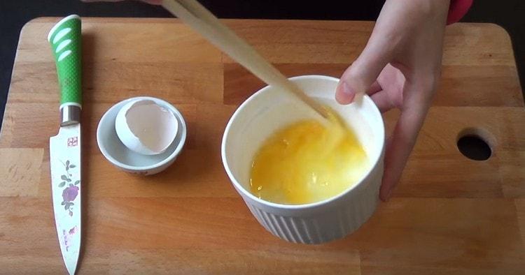 Beat the egg.