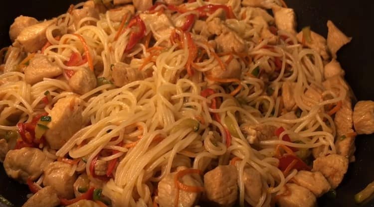 Add noodles to vegetables, mix.