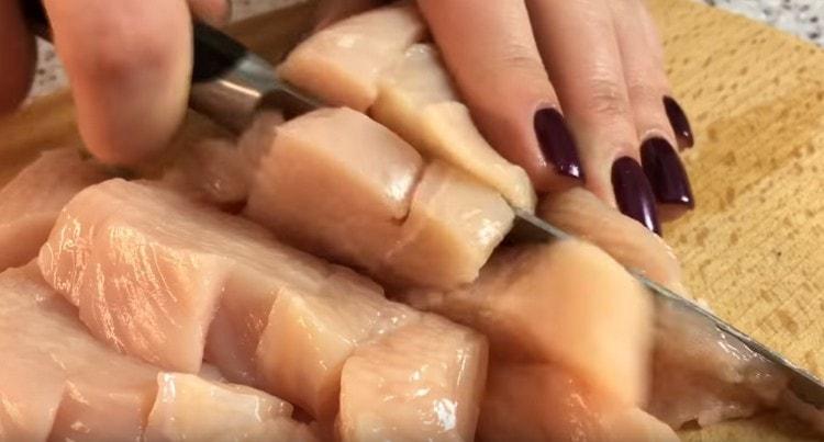 Cut the chicken into pieces.