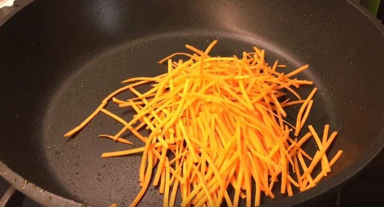 Sliced carrots or grated on a Korean grater, fry the carrots in a dry pan.
