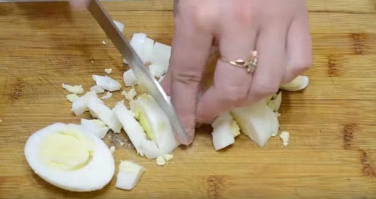 Hard-boiled eggs are diced.