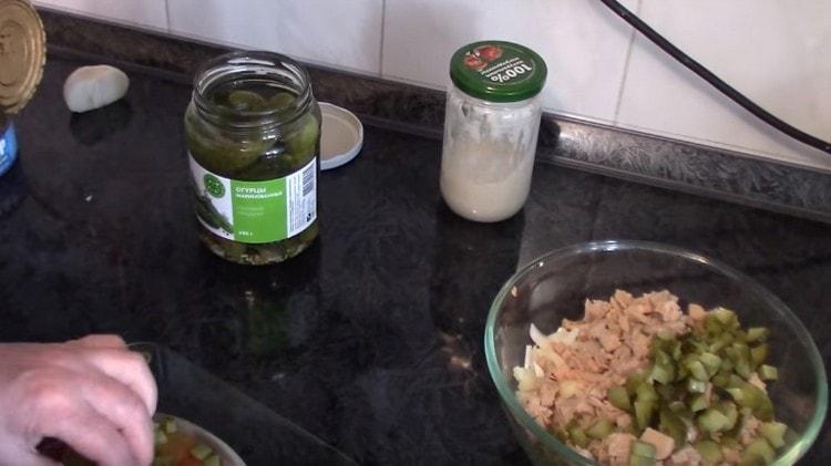 cut into small cubes pickled cucumbers.